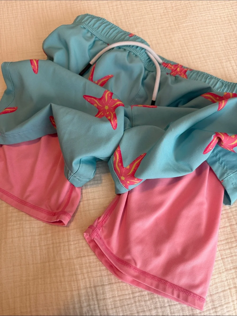 Kids Teal Swim Trunks with Pink Starfish Print